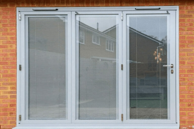 Grey patio doors with grey trickle vents, by Three Counties