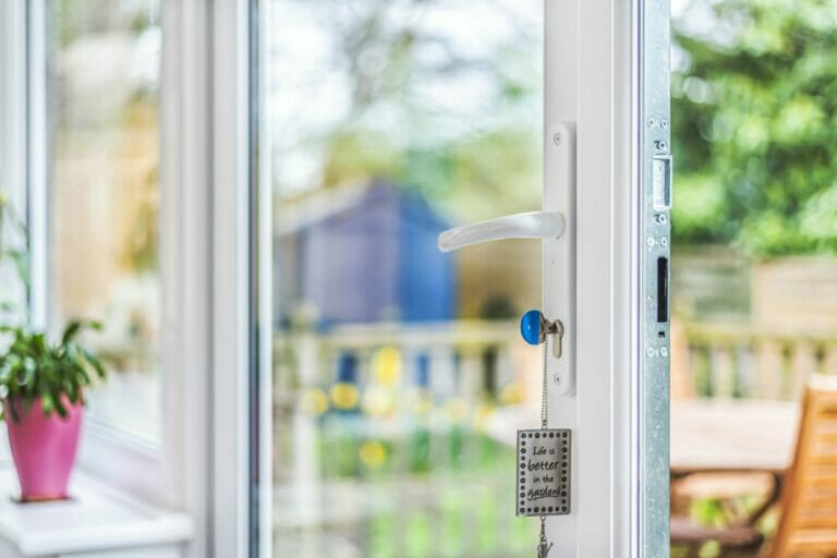 Close up of handle on French doors in conservatory